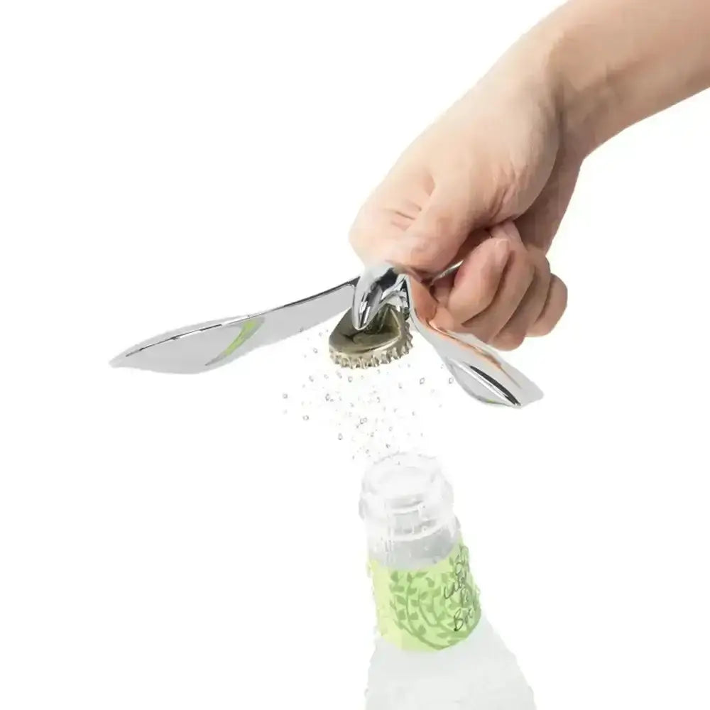 Hand using a bottle cap removal tool on a bottle with a white background