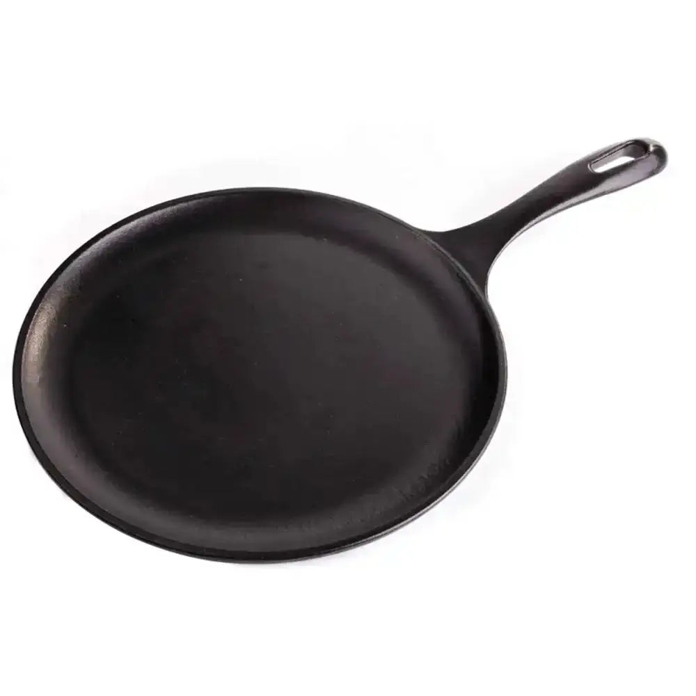 Black cast iron skillet on a white background