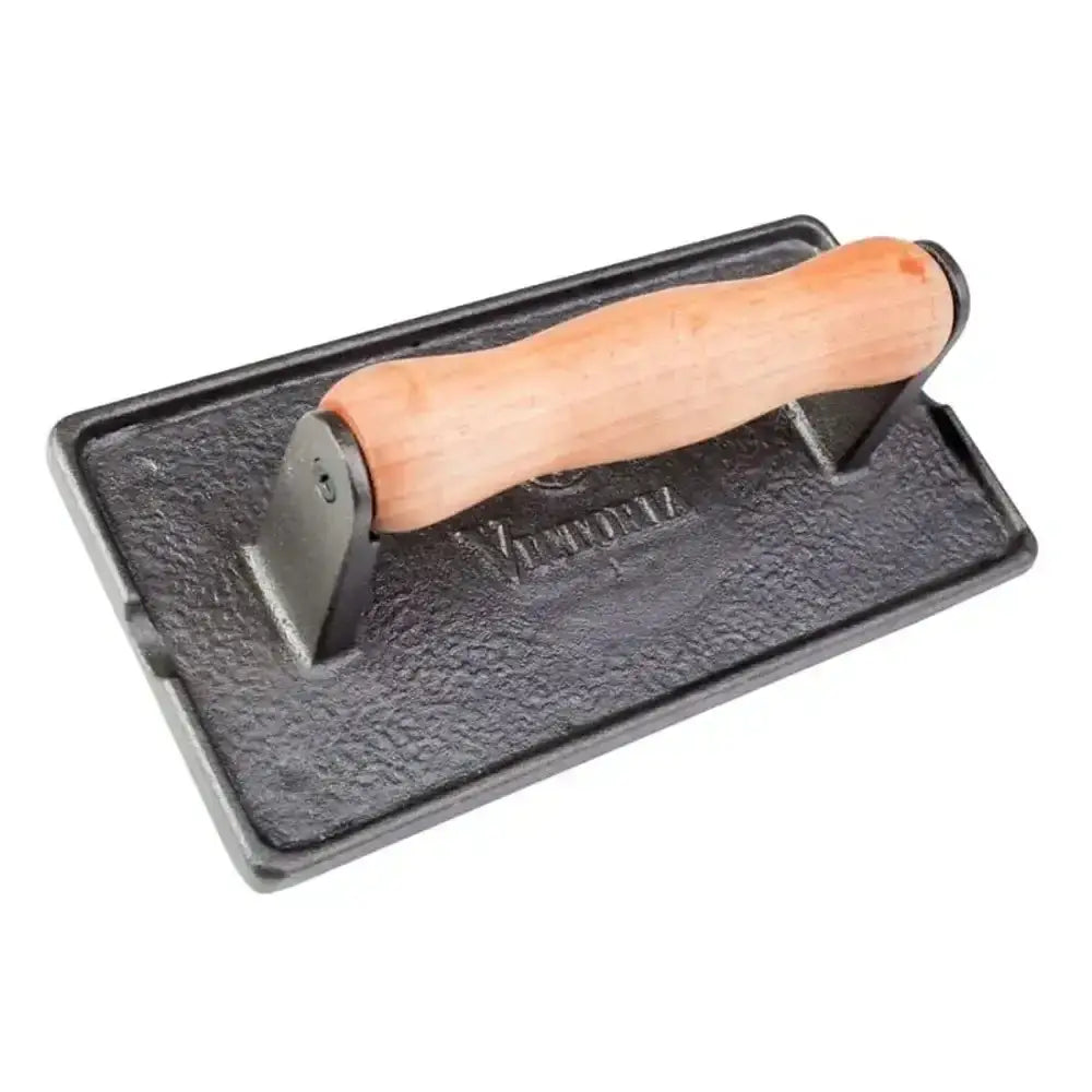 Black metal tool with wooden handle on a white background