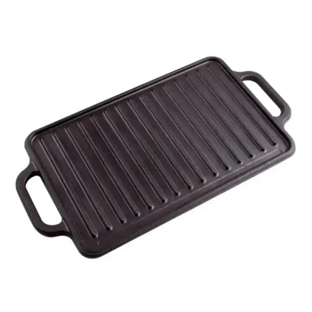 Black cast iron grill pan on a white background
