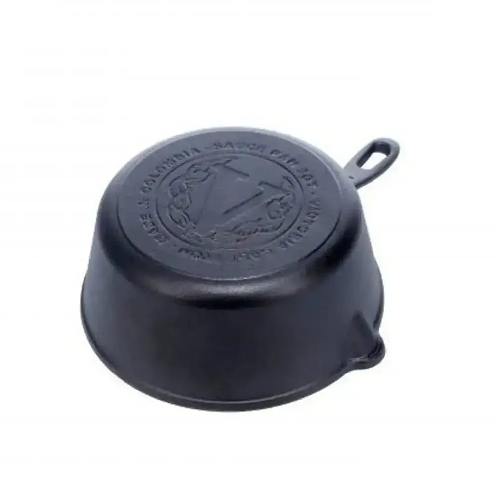 Black cast iron skillet with a logo on a white background