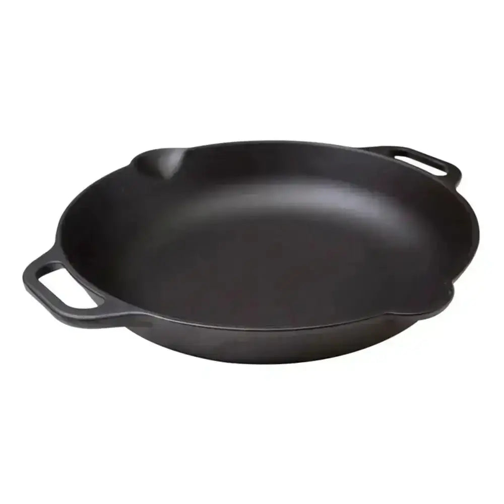 Black cast iron skillet on a white background