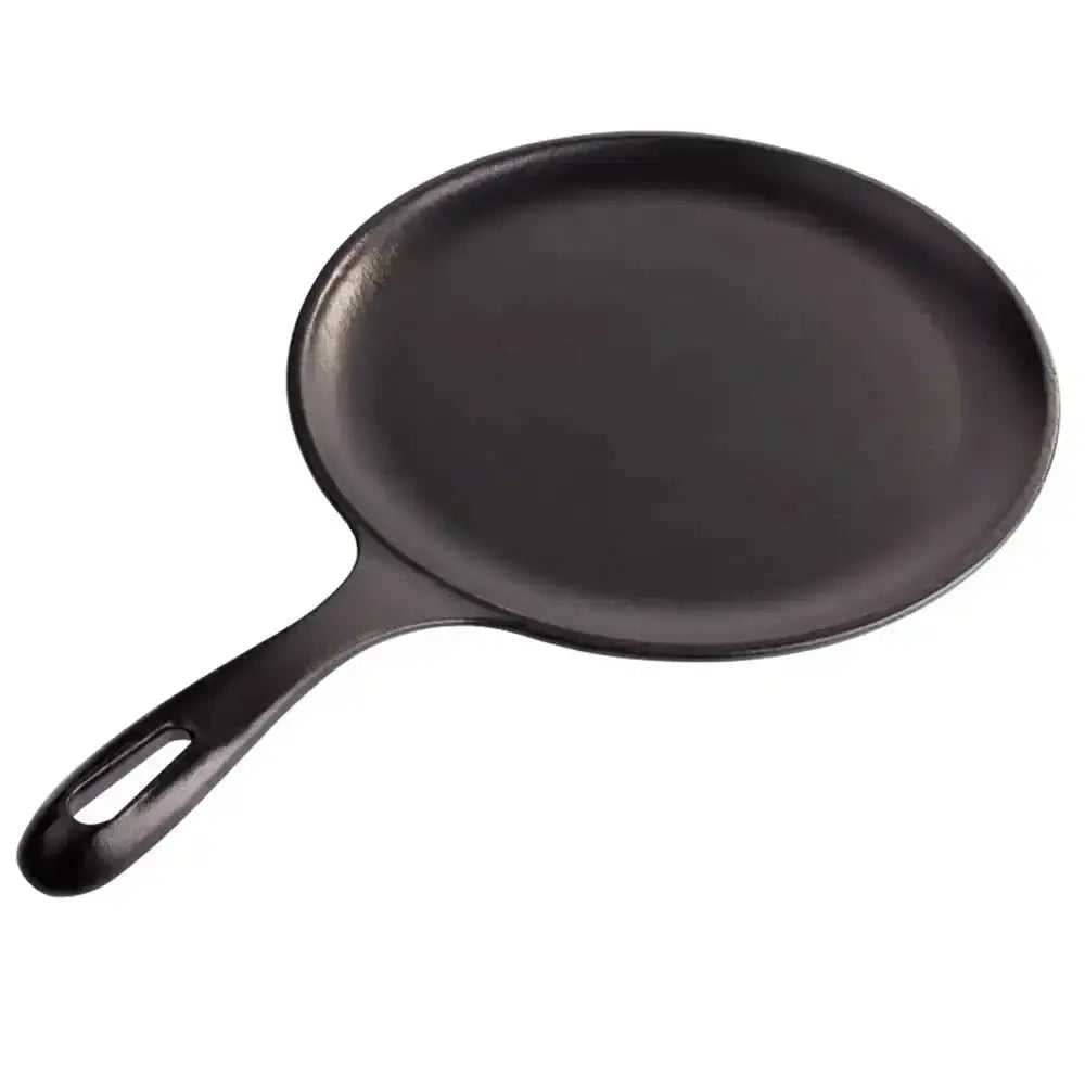 Black cast iron skillet on a white background