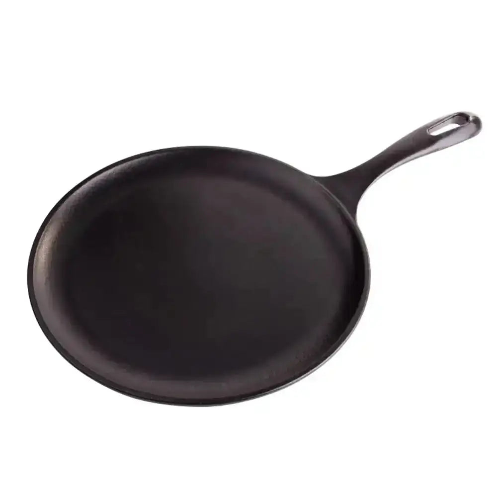 Black cast iron skillet on a white background