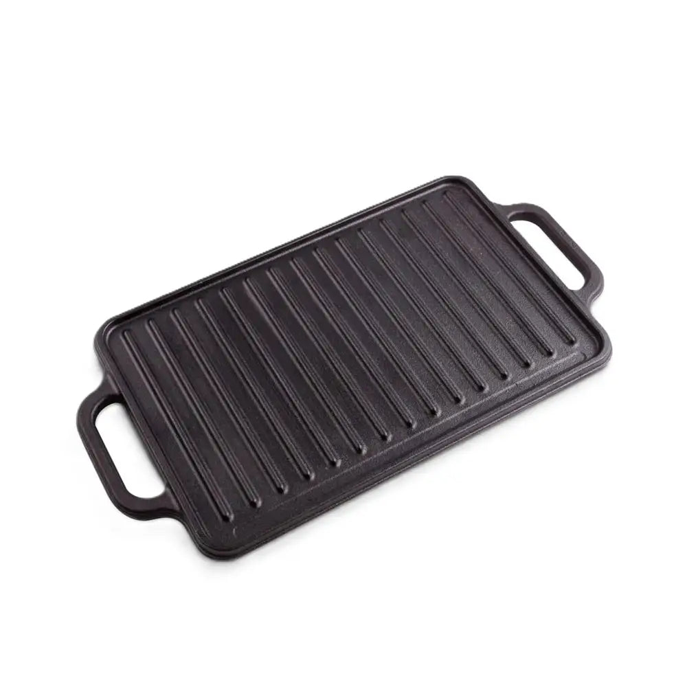 Black cast iron grill pan on a white background