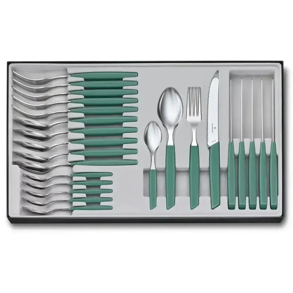 Set of silver cutlery with green handles in a box on a white background