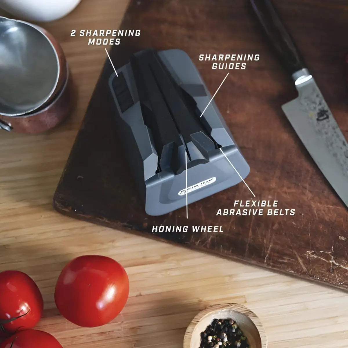 Knife sharpener on a wooden cutting board with tomatoes and spices, labeled for features.