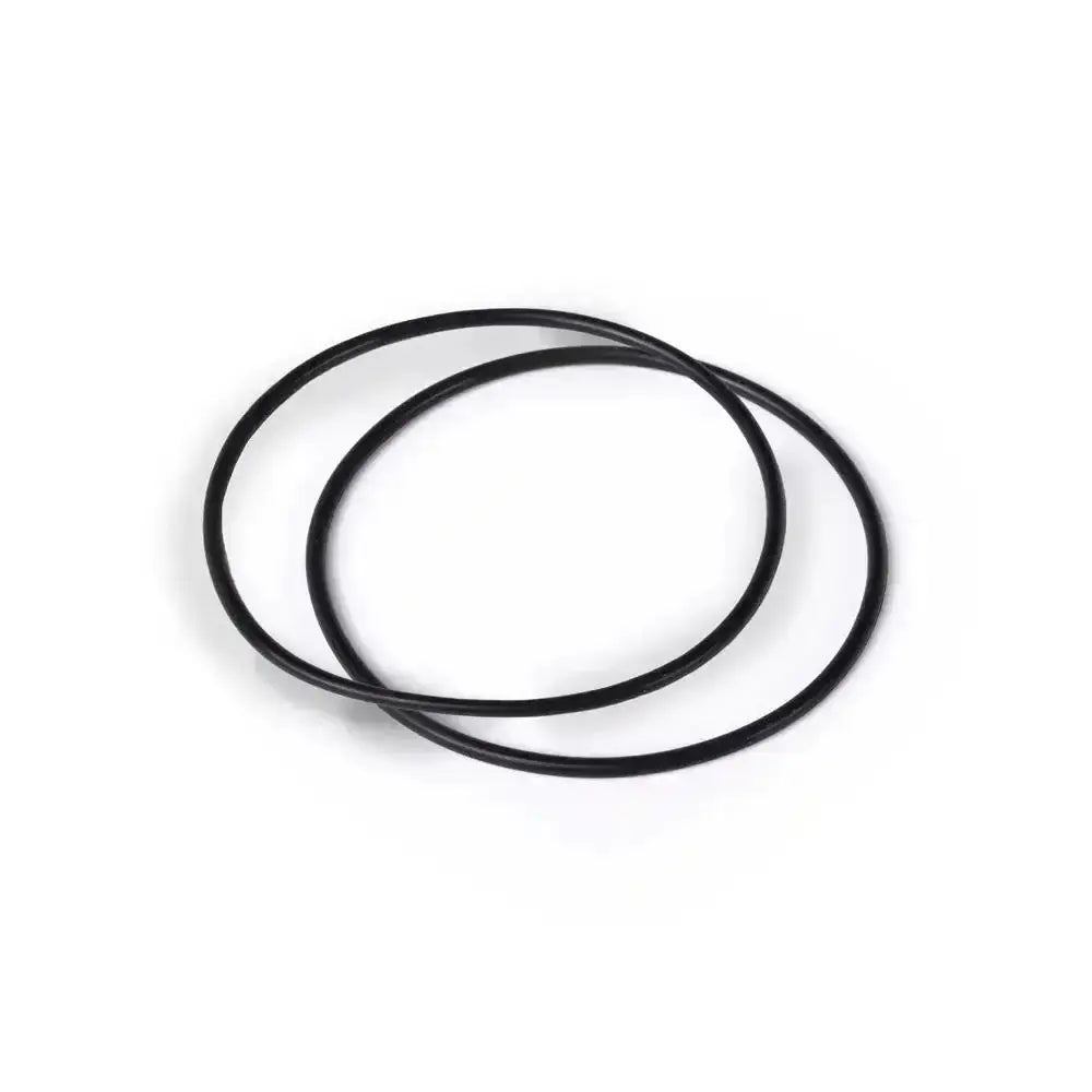 Two black circular objects on a white background