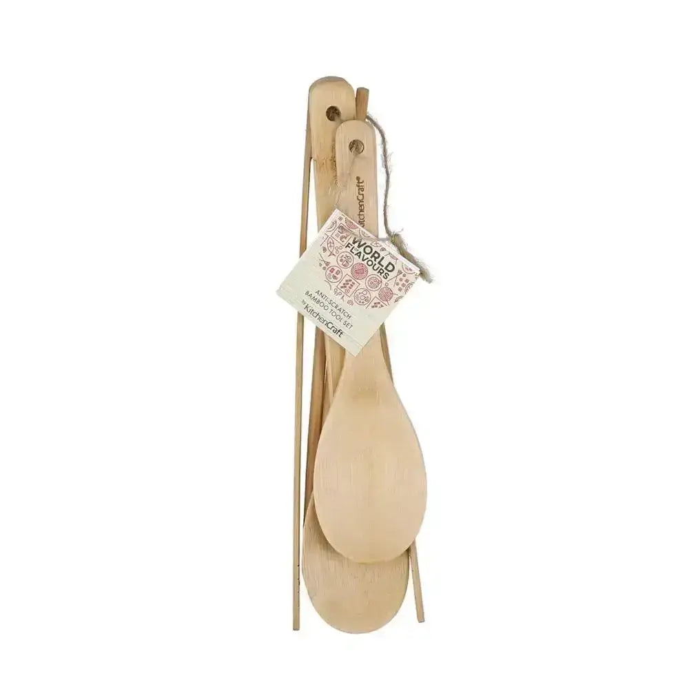 Natural bamboo utensil set with two spoons and two chopsticks on white background