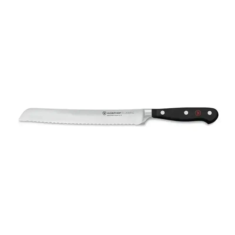 Wusthof bread knife with a black handle on a white background