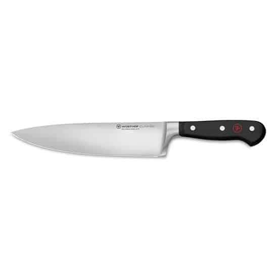 Chef's knife with a black handle on a white background