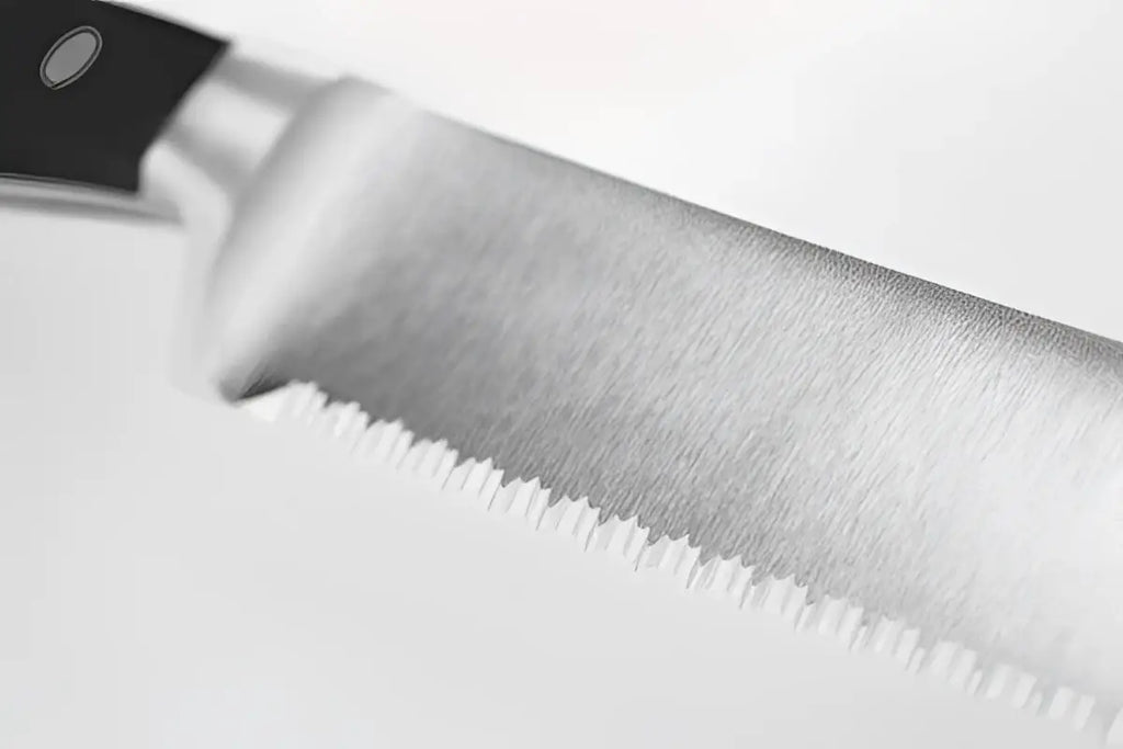 Close-up of a knife blade on a white background