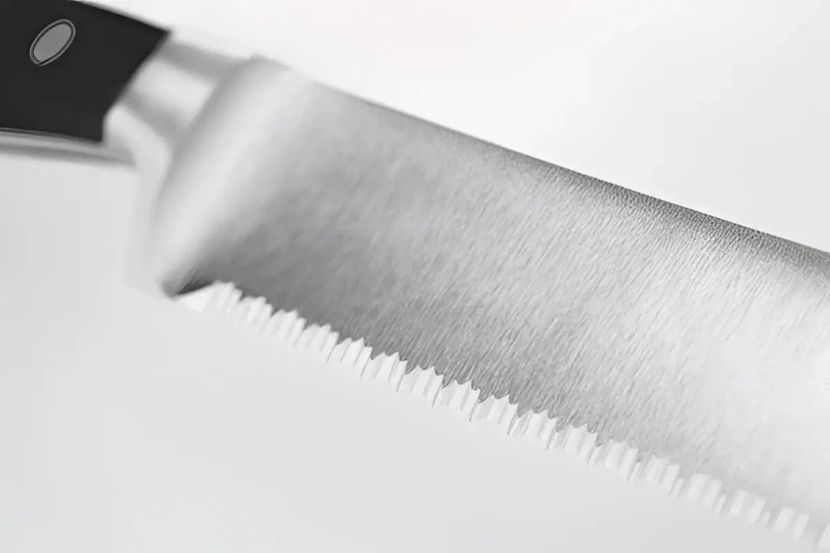 Close-up of a knife blade on a white background