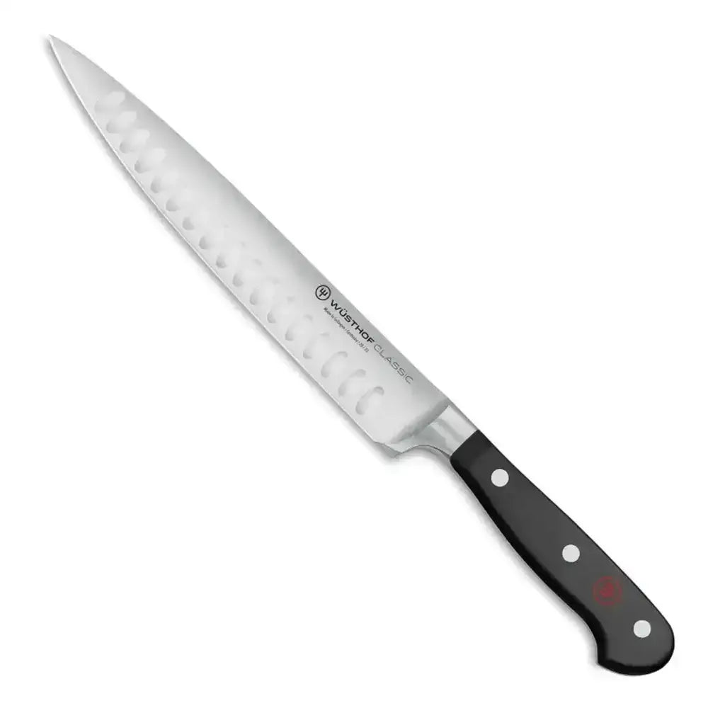 Knife with a black handle on a white background