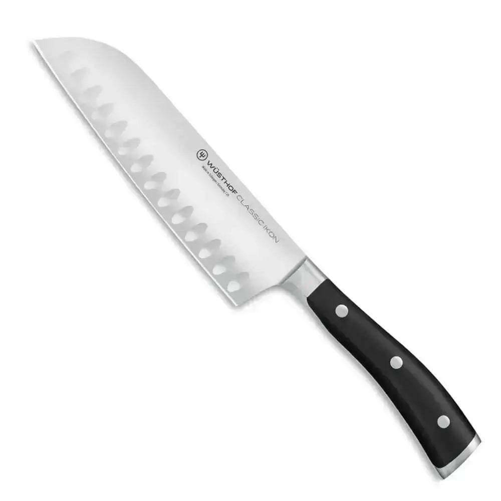 Chef's knife with black handle on a white background
