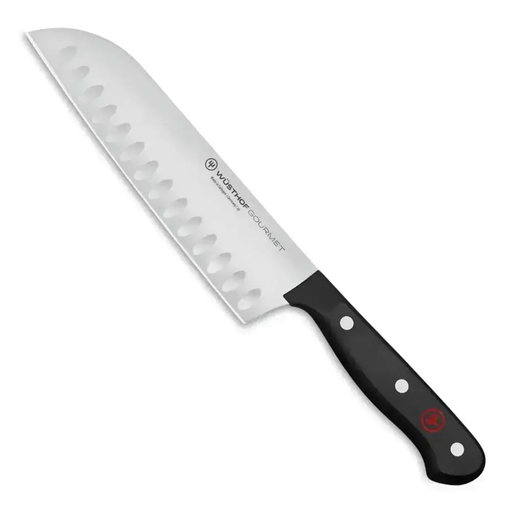 Serrated knife with black handle on a white background