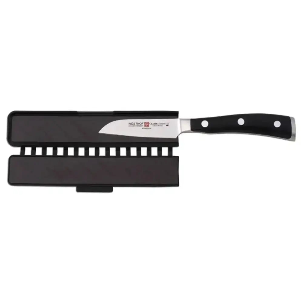 Knife with black handle and sheath on a white background