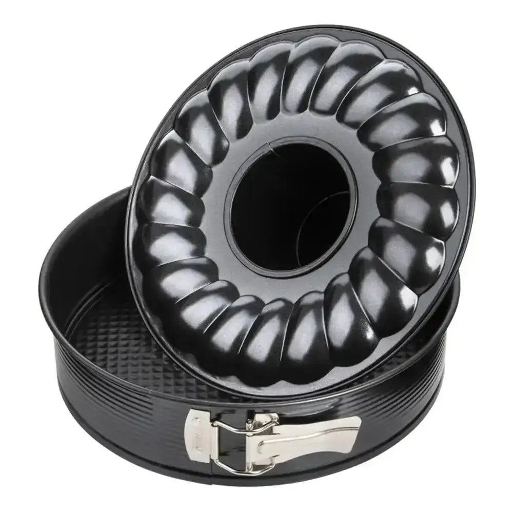 Black Bundt cake pan with ribbed design on a white background