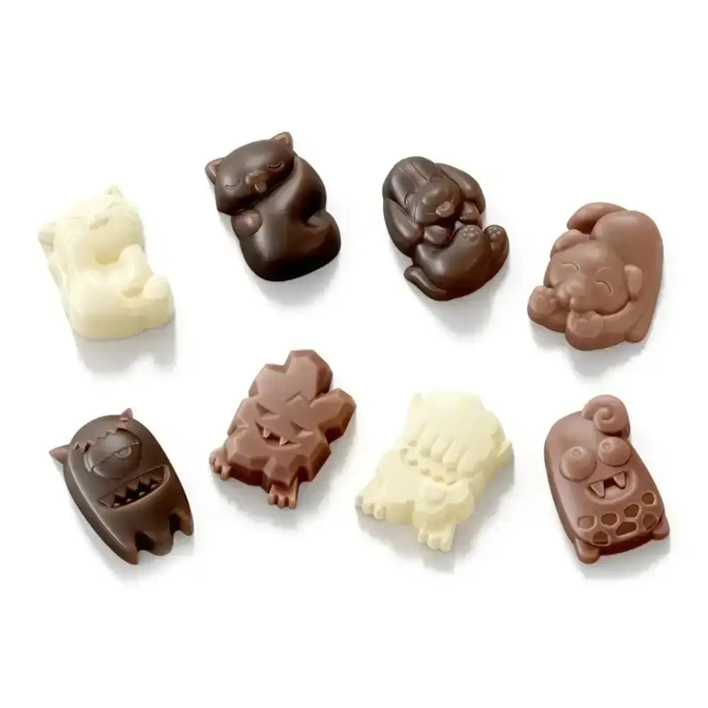 Assorted chocolate animal candies on a white background