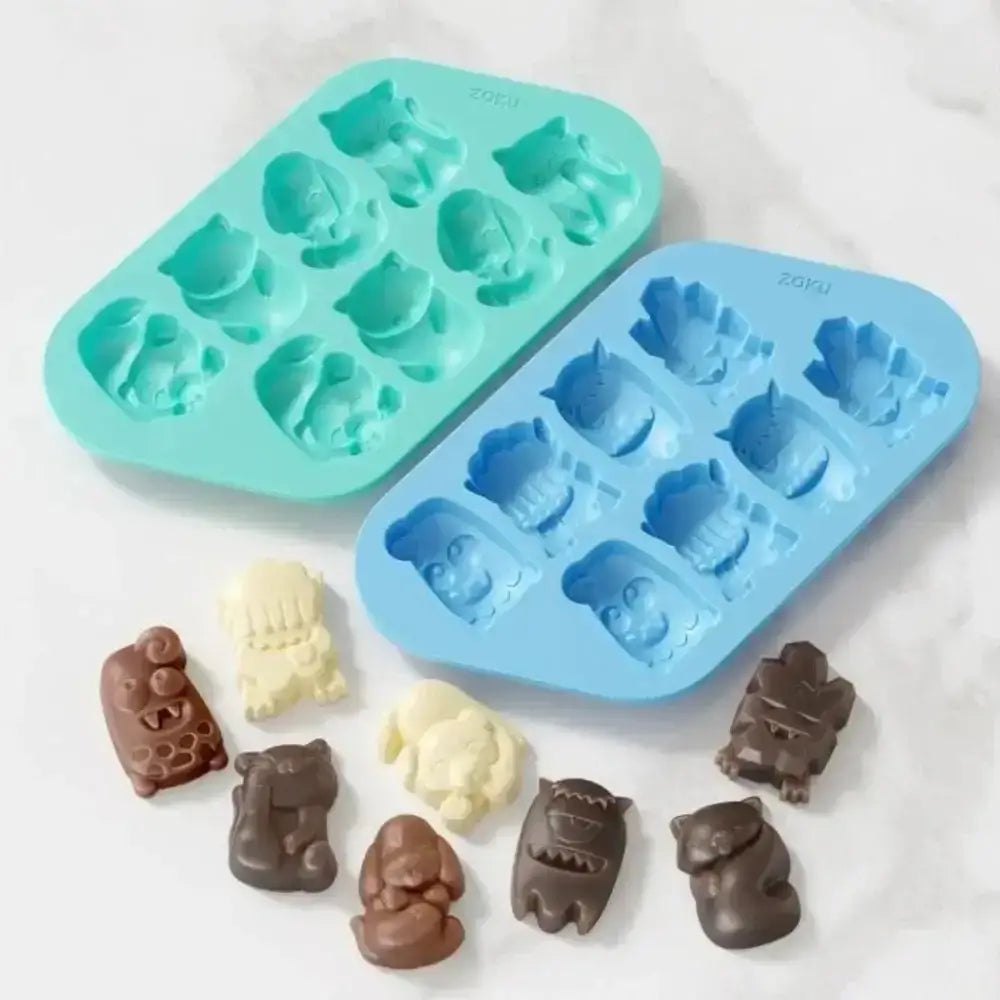 Two silicone mold trays with animal-shaped cavities, one filled with chocolate molds on a white background.