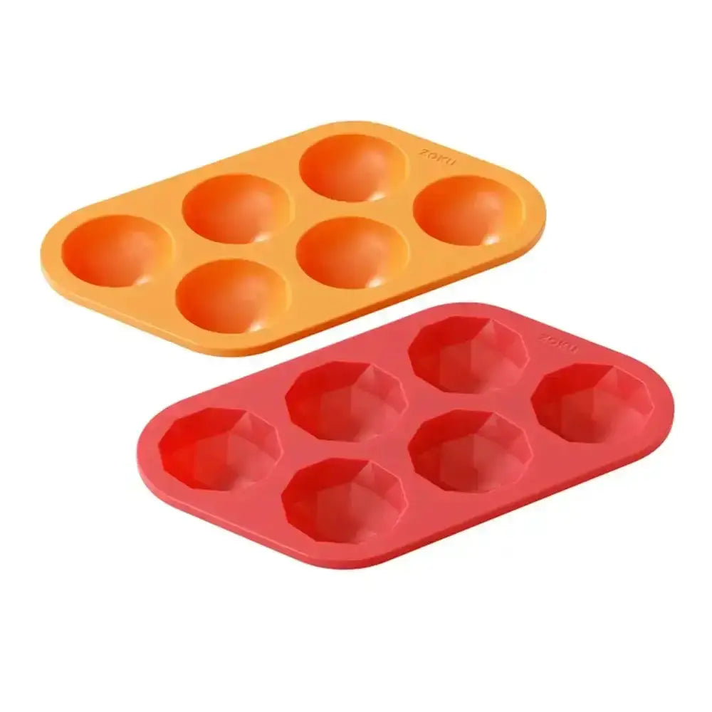 Orange and red silicone muffin trays on a white background