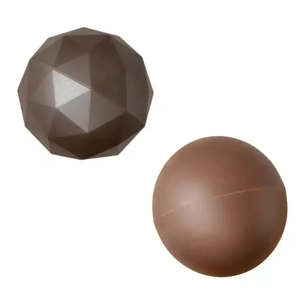Two brown balls, one faceted and one spherical, on a white background
