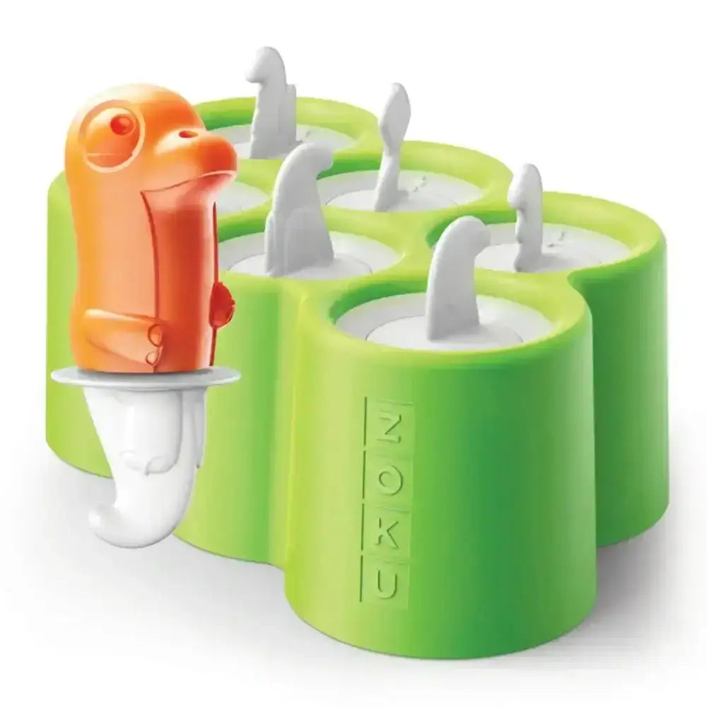 Green popsicle mold with dinosaur-shaped sticks on a white background