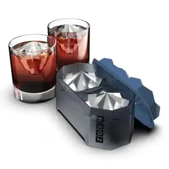 Zoku ice cube tray with two glasses of red liquid on a white background