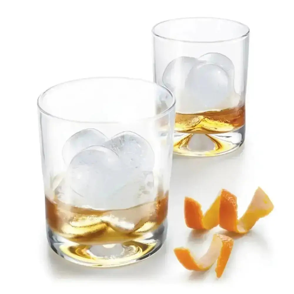 Two glasses of whiskey with heart-shaped ice cubes and orange peel garnish on a white background