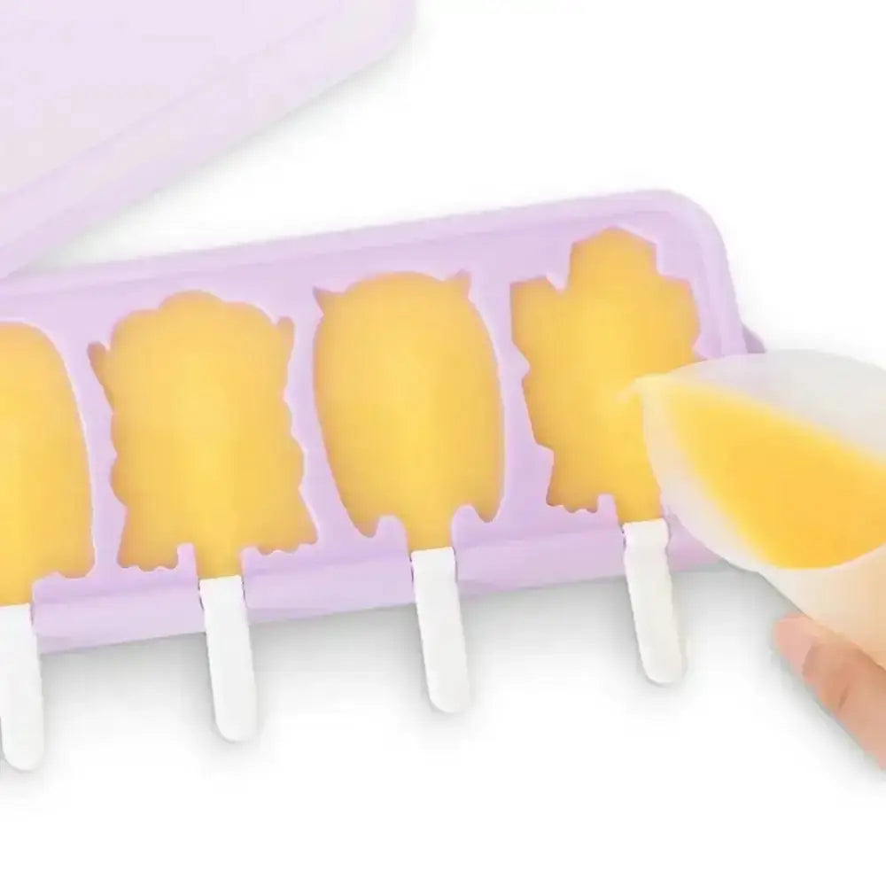 Silicone mold with pineapple-shaped ice cream bars on a white background