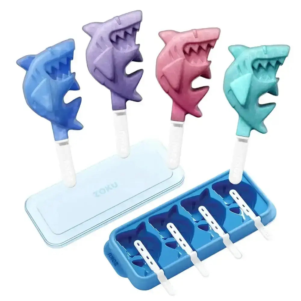 Set of shark-shaped ice pop molds with a blue tray on a white background