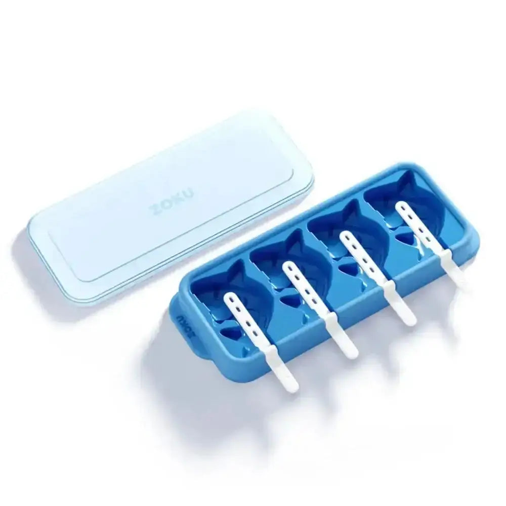 Blue ice pop mold with white sticks on a light gray background