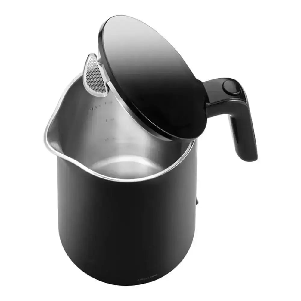 Black milk frothing pitcher with a stainless steel interior on a white background