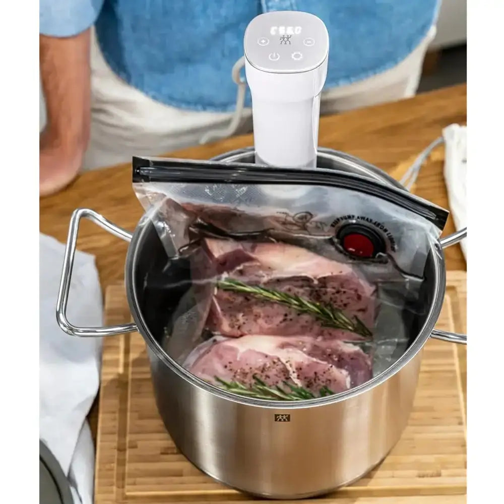 Vacuum sealer with food packaging on a wooden surface