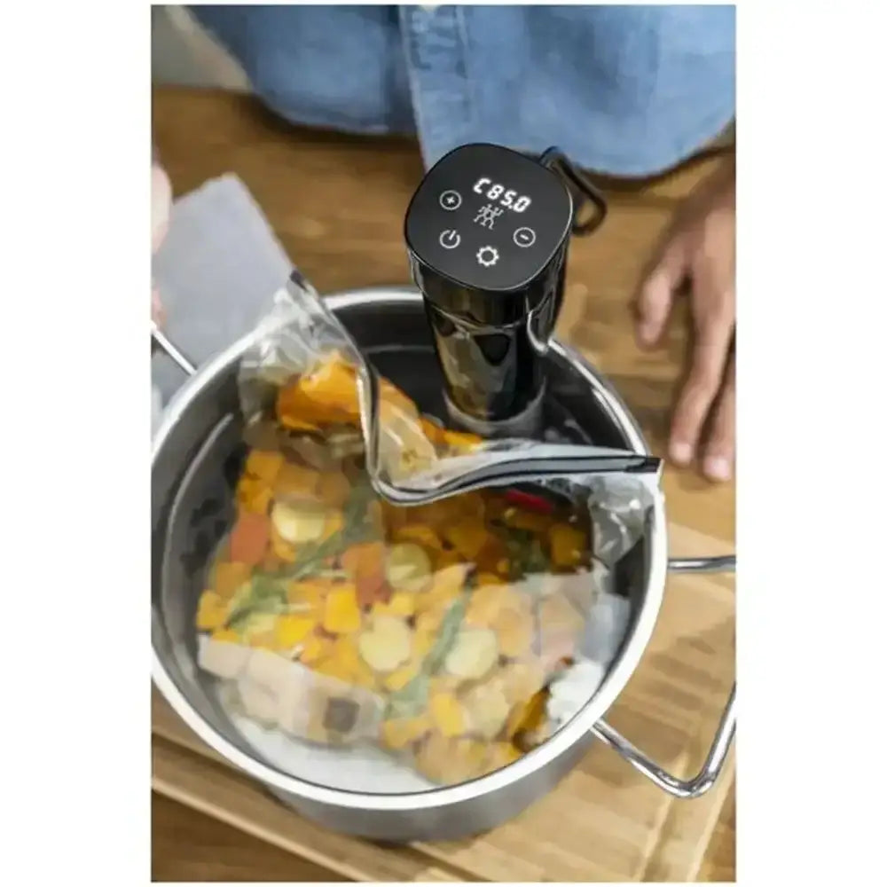 Vacuum sealer with food packaging on a wooden surface