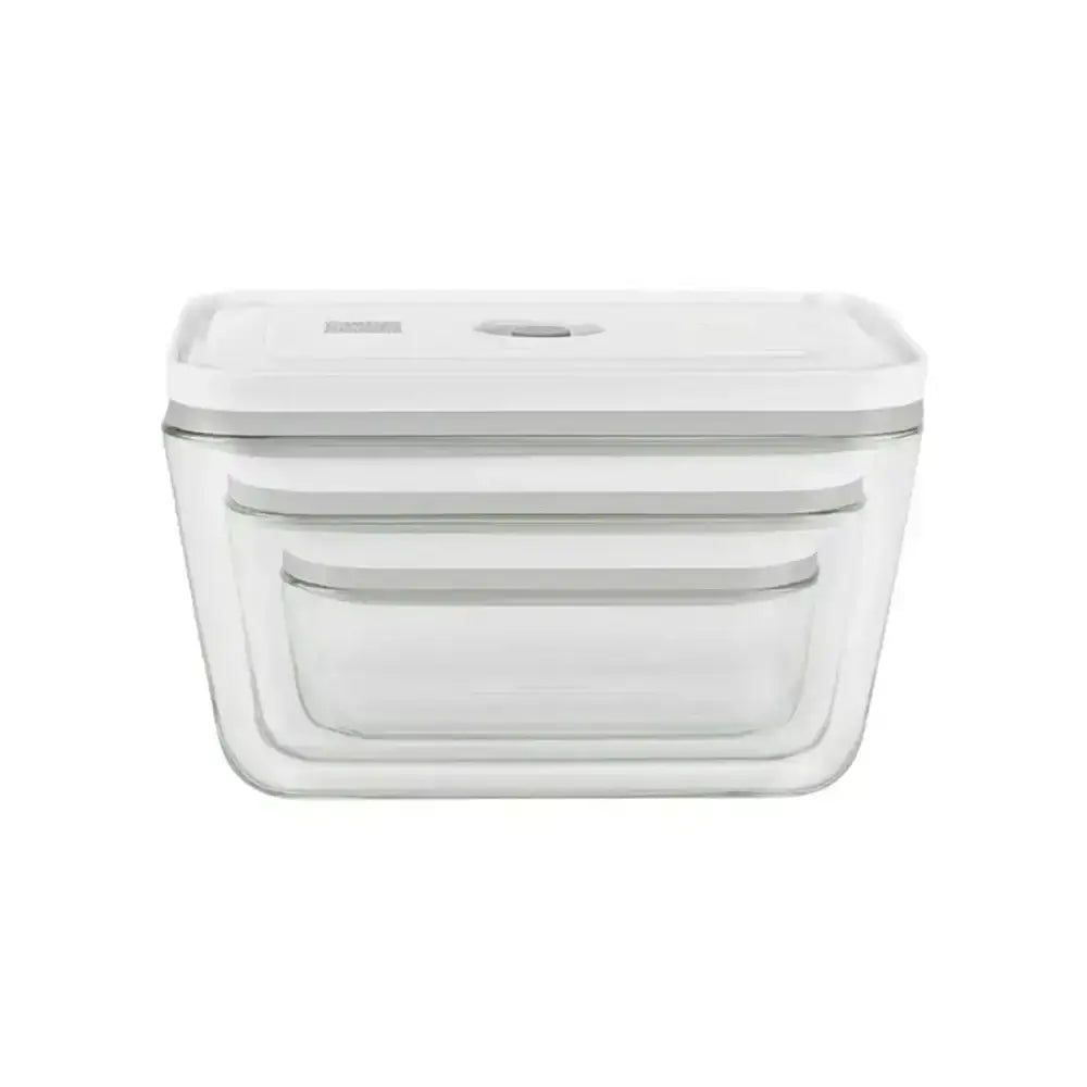 Clear glass food storage container with white lid on a white background