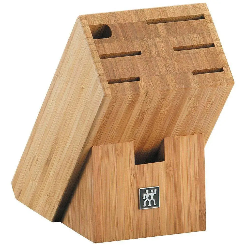 Wooden knife block with multiple slots on a white background