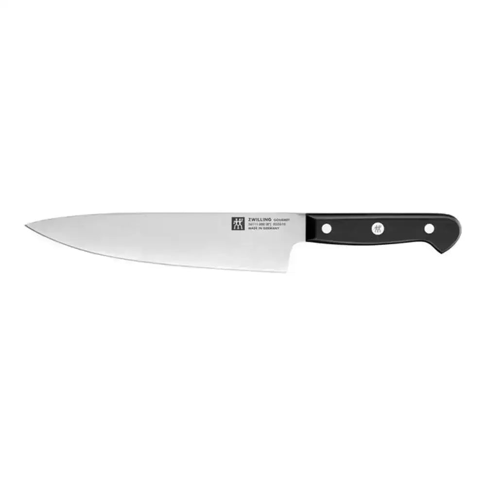 Serrated bread knife with black handle on a white background