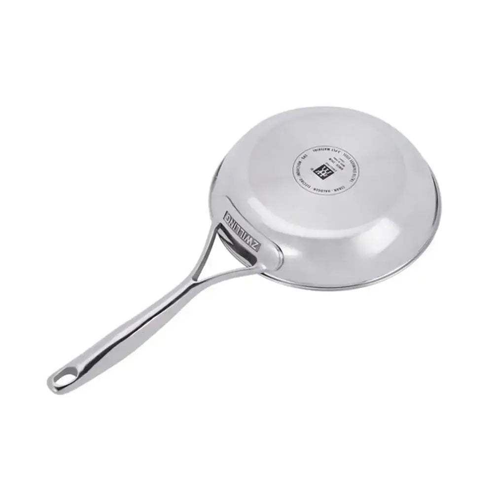 Stainless steel frying pan with handle on a white background