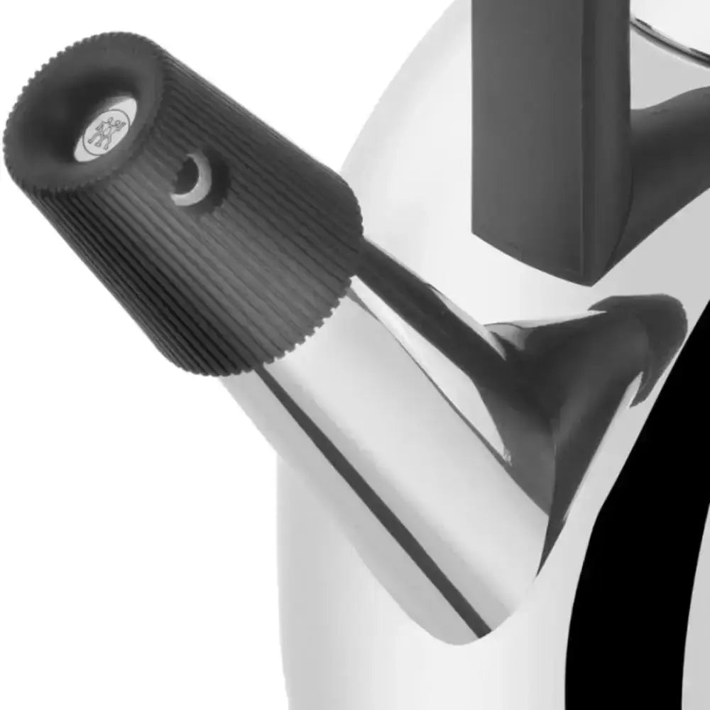Close-up of a black and clear kitchen tool on a white background