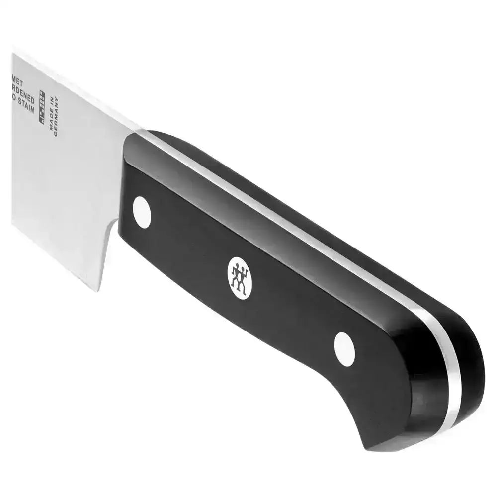 Black putty knife with a silver blade on a white background