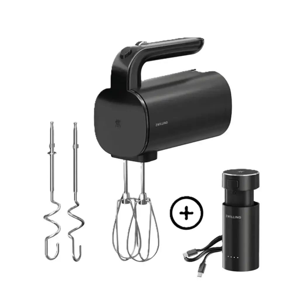 Black hand mixer with attachments on a white background
